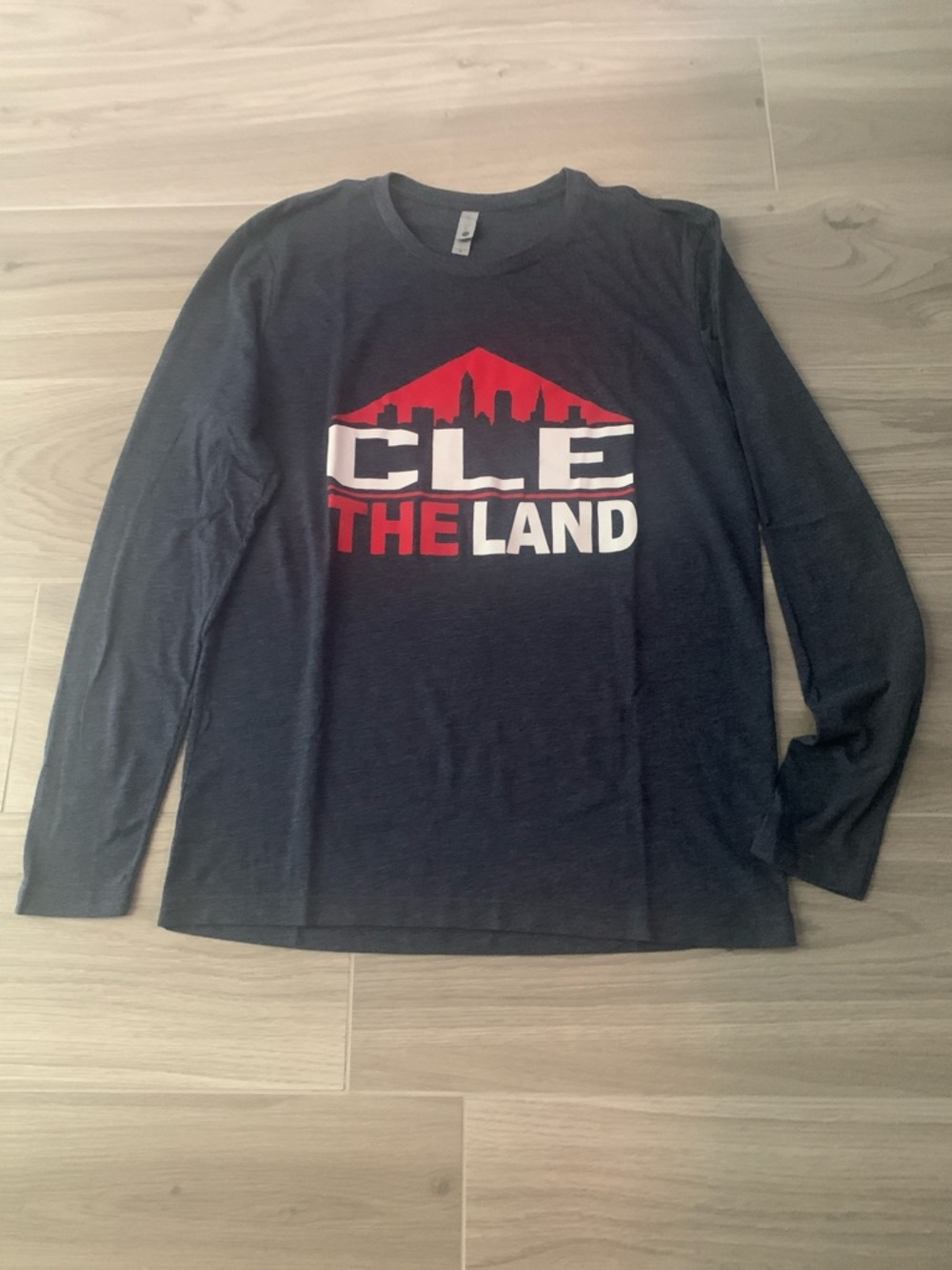 Next Level Apparel Black Long Sleeve Tee with Red and White CLE The Land Graphic